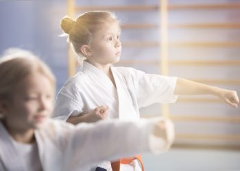 Girl in kimono practicing karate
