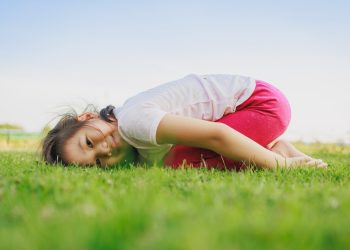 Kids meditating by doing yoga pose